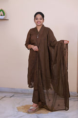 SreeVastra brown mul cotton 3-piece dress with delicate embroidery and matching dupatta worn by a smiling woman