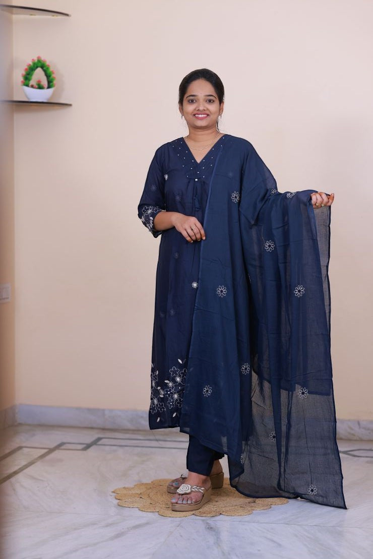 SreeVastra navy blue cotton 3-piece dress with white floral embroidery and matching dupatta worn by a woman