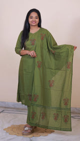 Woman wearing a SreeVastra olive green cotton 3-piece dress with red floral block print and matching dupatta