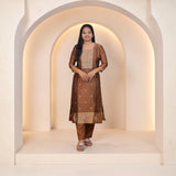 SreeVastra brown silk kurta set featuring intricate gold embroidery on the neckline and floral hem detailing.