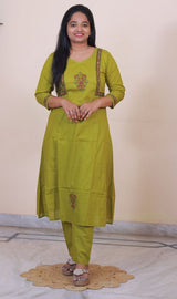 Woman wearing a SreeVastra olive green cotton 3-piece dress with embroidered floral details on the kurta and sleeves.